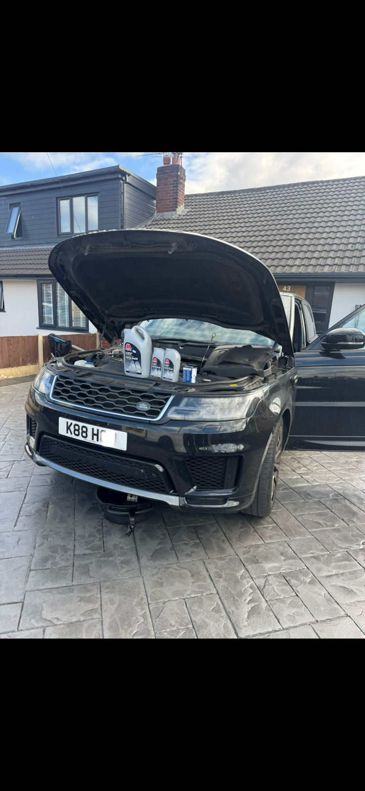 AL's Motors mechanic working on a customer's car